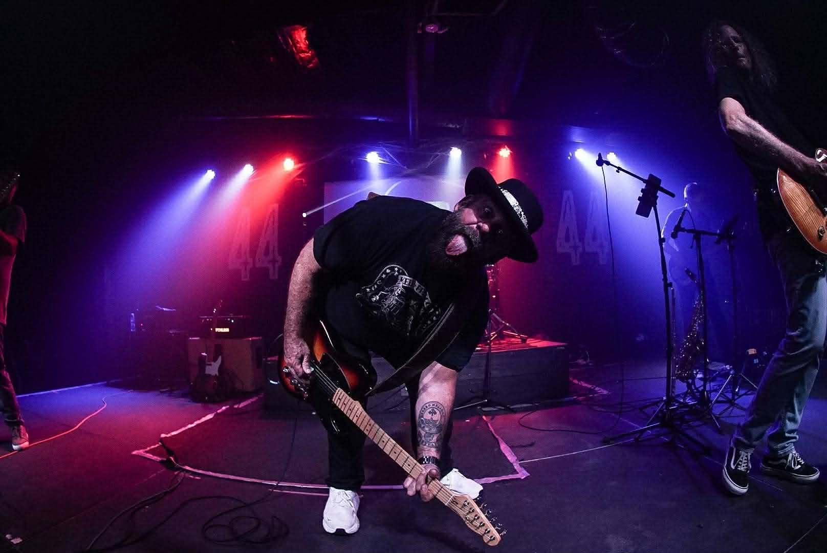 Mark Moffatt playing guitar and mugging for the camera — The Glorious Heydays