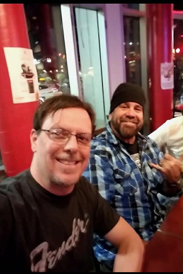 Matt Sadler and Mark Moffatt of The Glorious Heydays at a table sharing a meal